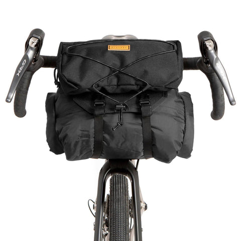 a close up of a bicycle with a bag on the back