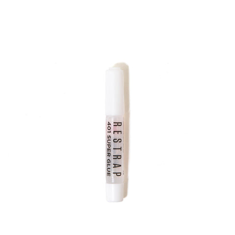 a tube of lip bale sitting on top of a white surface