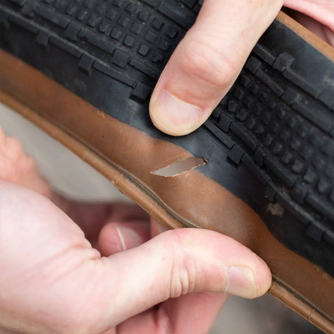 a close up of a person touching a tire