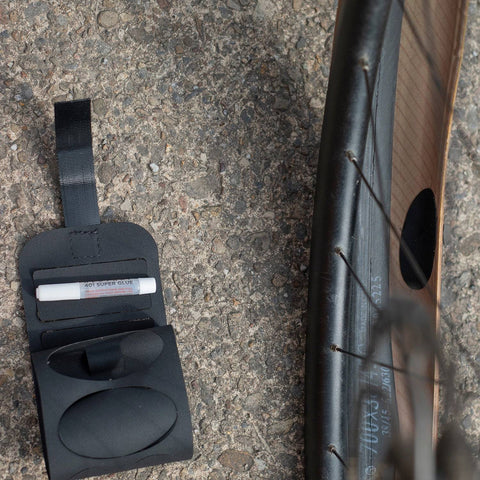 a close up of a bike tire and a wallet