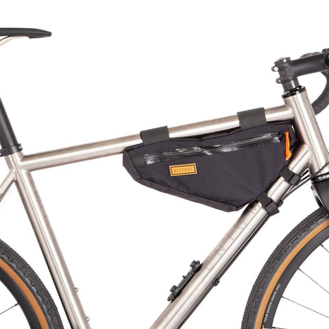 a bicycle with a bag attached to the front of it