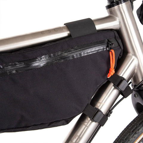 a close up of a bike with a bag on the back