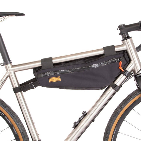 a close up of a bike with a bag on the back