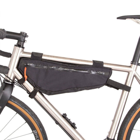 a bicycle with a bag attached to the front of it